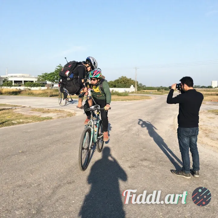 Edit the input image to make the wheelie slighty higher and remove the shadow of the photographer